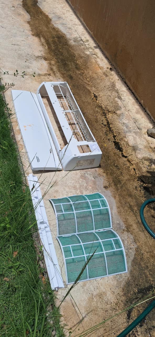 Cleaned split unit parts on lawn